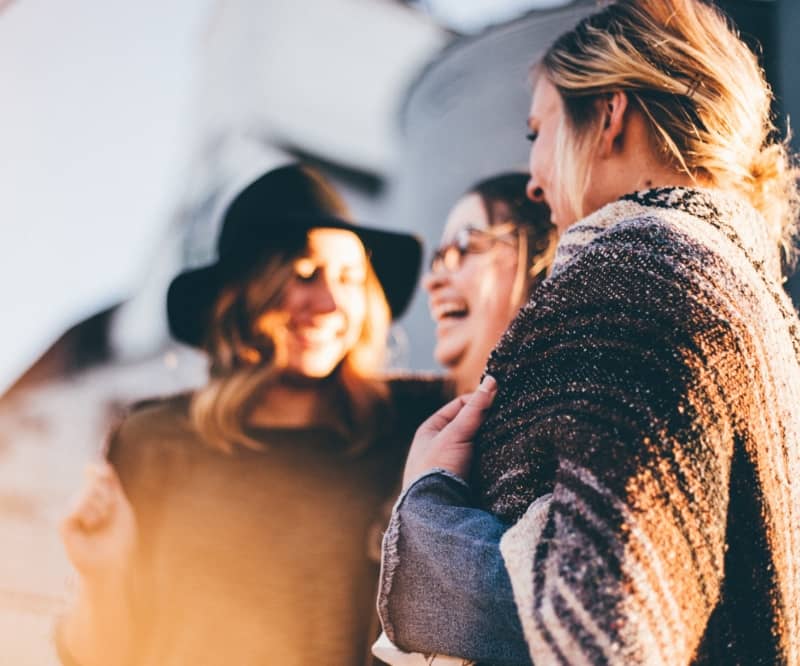 gruop of women smiling and laughing